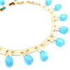metal squares made into necklace with turquoise stones throughout