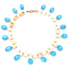 metal squares made into necklace with turquoise stones throughout