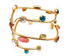 Gold metal swirl bangle with colorful Swarovski stones