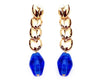 heart shaped metal decals stacked with a blue stone at bottom