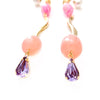 pink metal egg accent with gold swirl dangle and Swarovski stone earrings