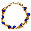 Gold chain with blue Swarovski stones and triangle cutout details