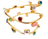 Gold metal swirl bangle with colorful Swarovski stones