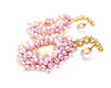 cluster of pearls in wreath shape dangling from Swarovski stones