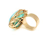 Gold twisted metal around turquoise stone ring