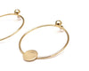 gold circle earrings with solid circle decal