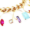Thick Gold link chain adorned with horse shoe shaped pendants and colorful Swarovski stones