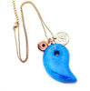 dainty necklace with evil eye bead Persian coin and large blue stone pendant