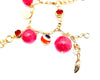 red charm bracelet with evil eye bead, bell jingles