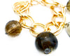 natural brown colored stone charm bracelet on gold link chain