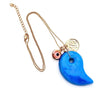 dainty necklace with evil eye bead Persian coin and large blue stone pendant