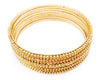 Gold bangles with ball details