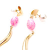 pink metal egg accent with gold swirl dangle and Swarovski stone earrings