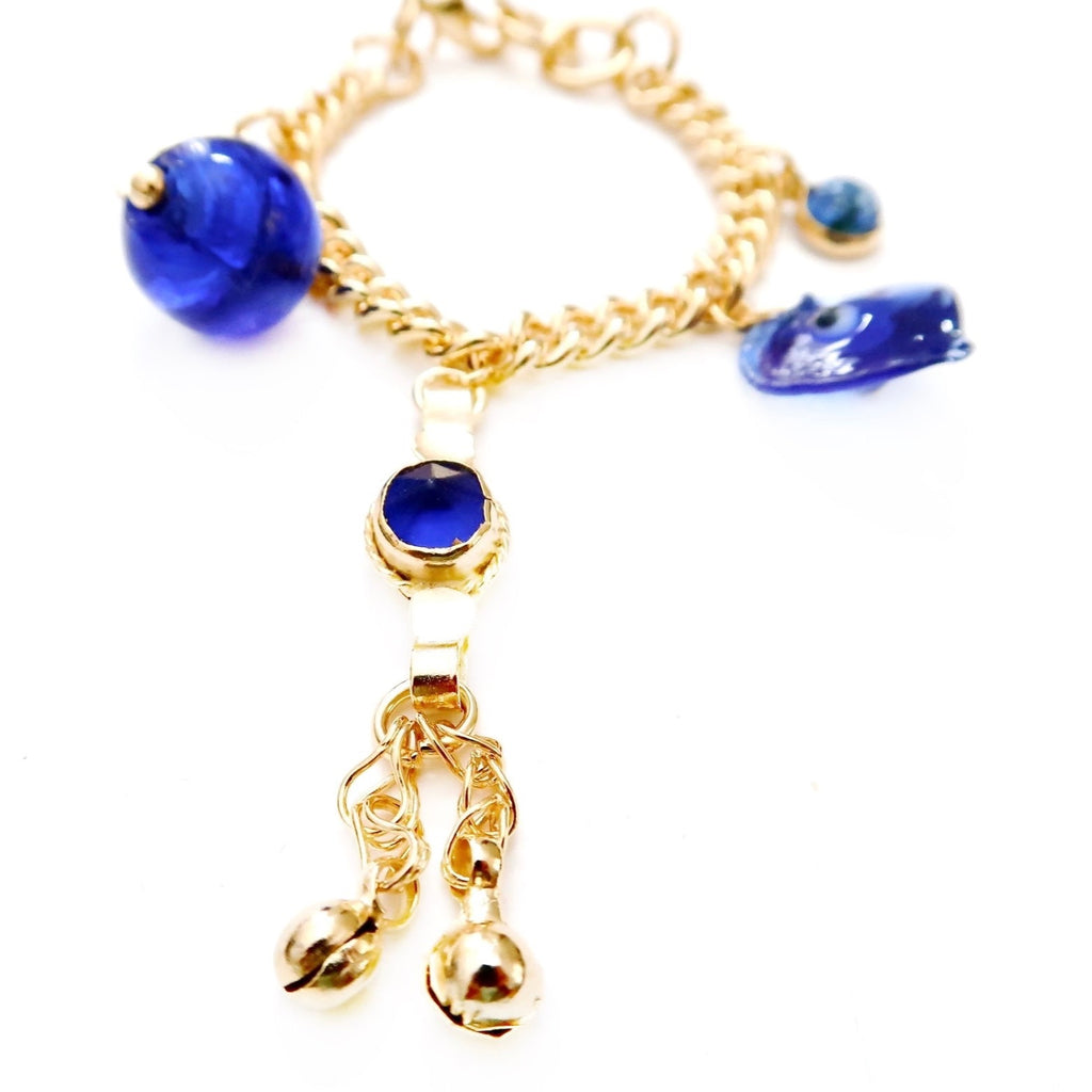 metal chain charm bracelet with blue evil eye, blue stone, Persian coin and hand jewels