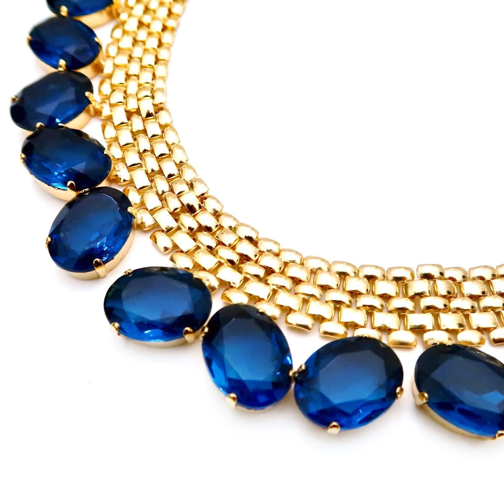 Thick gold chain with large blue Swarovski stones