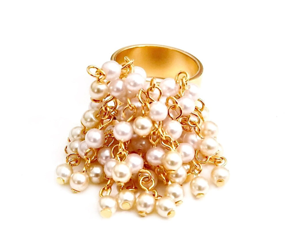 Cluster of pearls dangling from metal ring