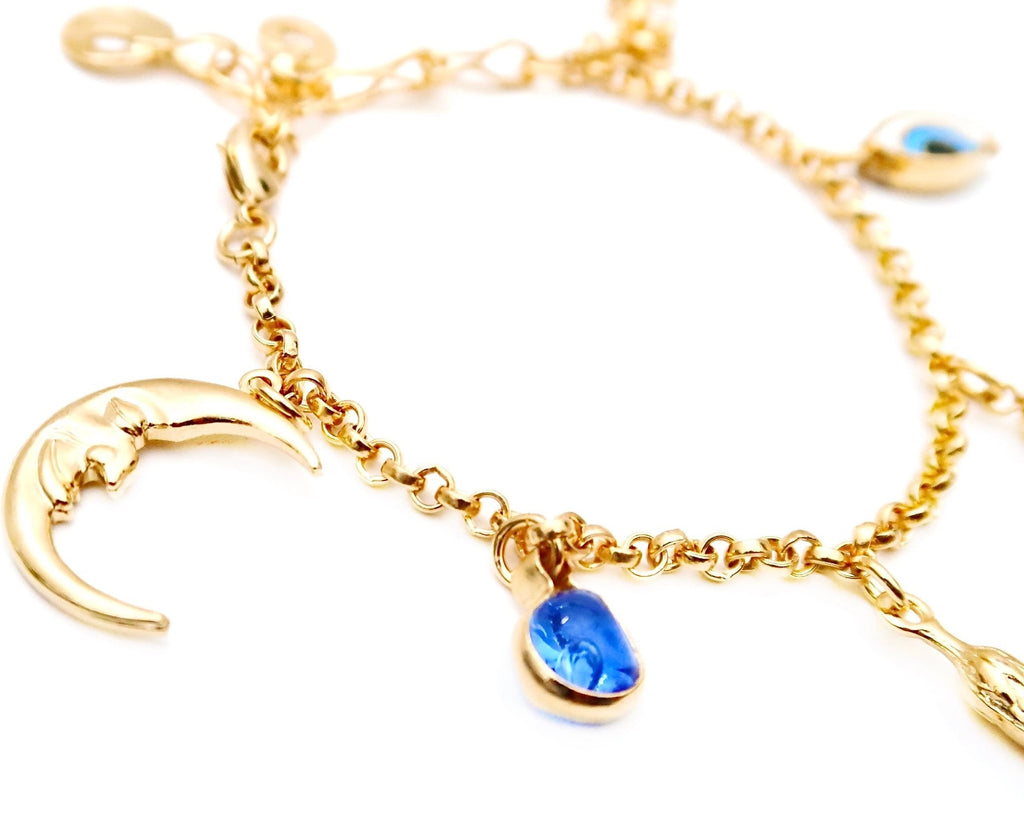 charm bracelet with fringe, crescent moon evil eye and blue stone 