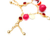 red charm bracelet with evil eye bead, bell jingles