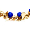 Gold chain with blue Swarovski stones and triangle cutout details