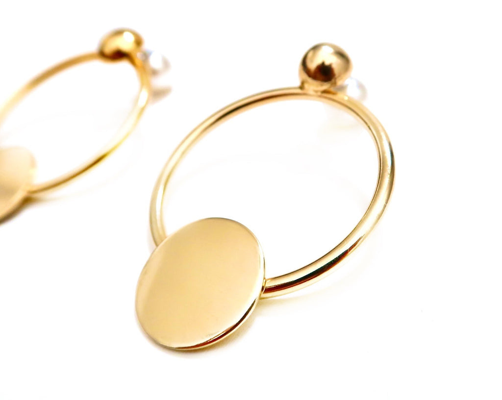 gold circle earrings with solid circle decal