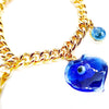 metal chain charm bracelet with blue evil eye, blue stone, Persian coin and hand jewels