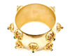 Gold bangle with protruding points and Swarovski stones