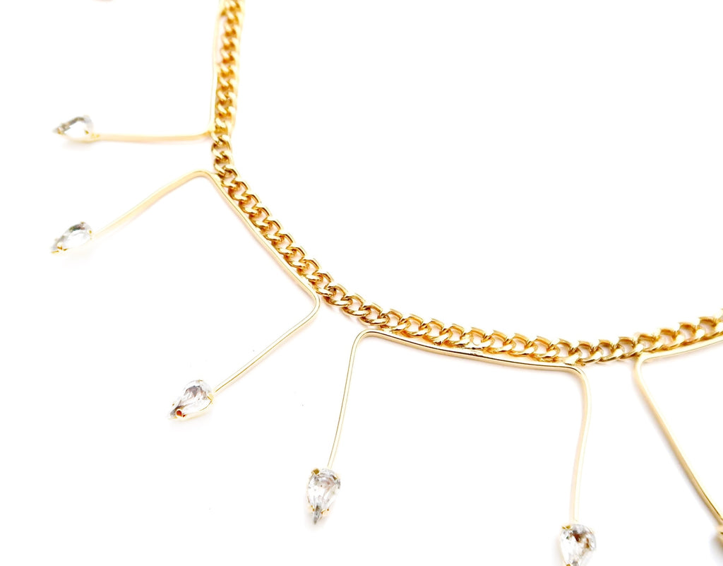 delicate gold link chain with U shaped pendant adorned with Swarovski stones at ends